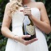 romantic summer wedding - bride with champagne