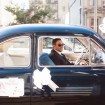 berry-hued wedding - groom in vintage car