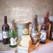 berry-hued wedding - message bottles in lieu of guest book