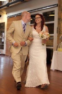 rustic wedding - bride and groom entering reception