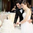 winter wedding - bride and groom cutting cake