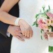 garden party wedding - bride and groom holding hands