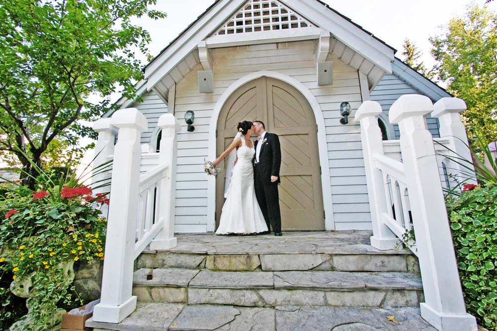 vintage wedding - kiss outside chapel
