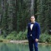 sophisticated picturesque wedding - groom by the water