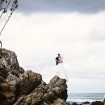 A Colourful DIY Beach Wedding in Australia - Couple on Rocks Wide Shot