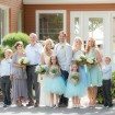 A Rustic Vintage Wedding in Kingston, Ontario - Bride and Groom Posing with Extended Family