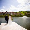 Charming Rustic Wedding in Collingwood, Ontario - Bride and Groom Holding Hands on Dock
