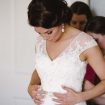Charming Rustic Wedding in Collingwood, Ontario - Bride Putting on Dress