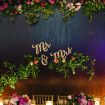 a whimsical modern fairytale wedding in toronto - flower wall backdrop