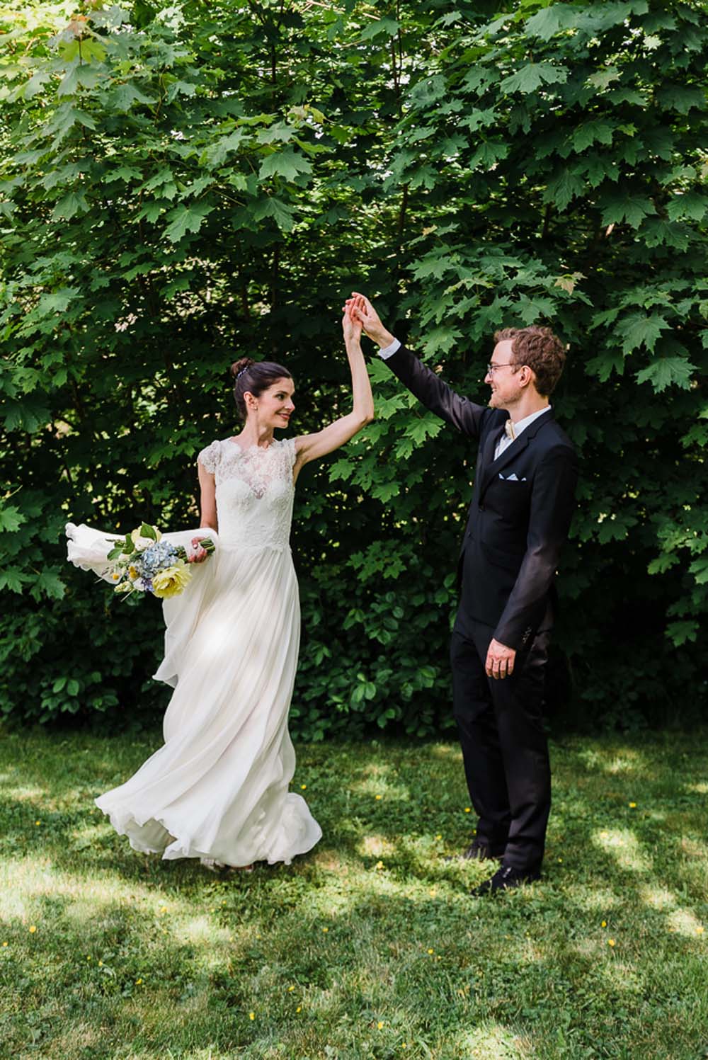 A-Rustic-Backyard-Wedding-in-Nova-Scotia- Groom Twirling Bride