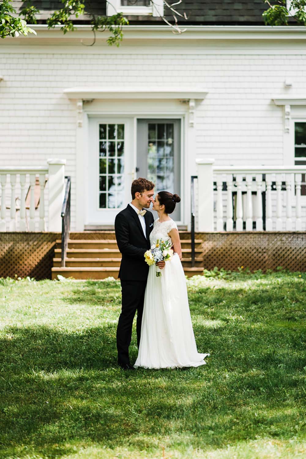 A-Rustic-Backyard-Wedding-in-Nova-Scotia- Bride and Groom Kiss
