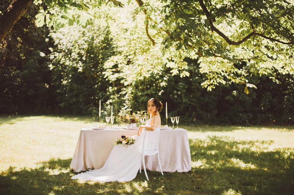 Modern Autumn Botanical Wedding Inspo - Bride at table